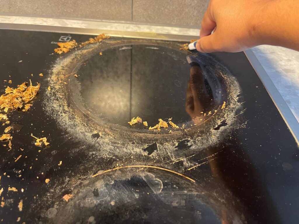 how to clean cooked on grease from stove top