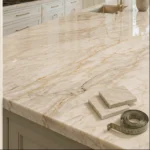 Quartzite kitchen countertop with stone samples and measuring tape